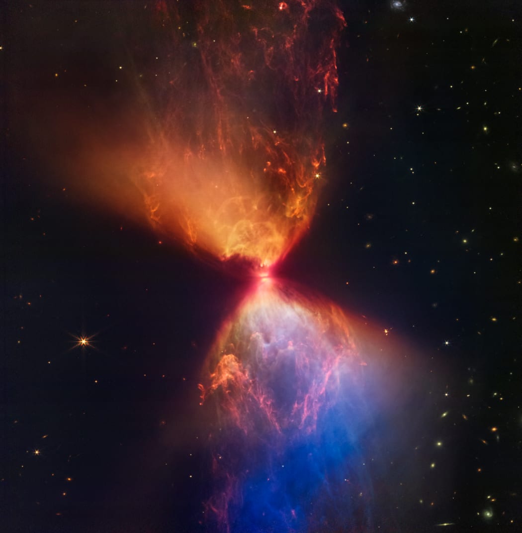The ‘hourglass protostar’, a star still in the process of accreting enough gas to begin fusing hydrogen.