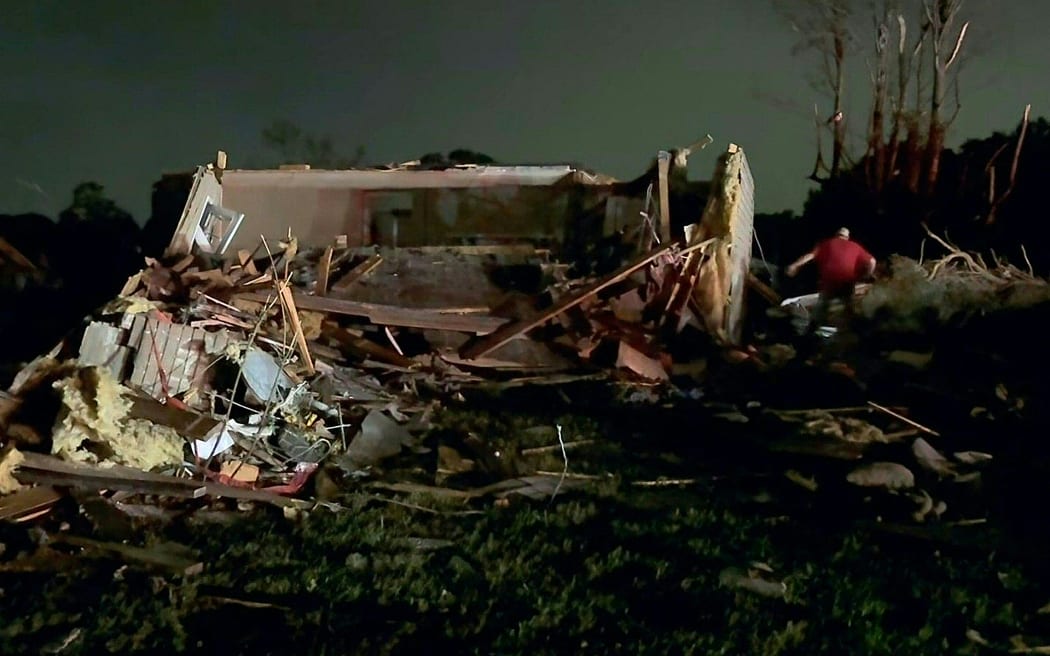 In this still image obtained from the Laurel County Fiscal Court in Kentucky, local residents search through tornado damage in Laurel County near London, Kentucky, on May 17, 2025. More than 20 people have died after severe storms swept through the southern US states of Missouri and Kentucky, officials and local media reports said May 17, 2025. Kentucky governor Andy Beshear said on X that at least 14 people had died in Friday night's storms. At least seven people were killed in Missouri, the Washington Post reported. (Photo by Handout / Laurel County Fiscal Court / AFP) / RESTRICTED TO EDITORIAL USE - MANDATORY CREDIT "AFP PHOTO / LAUREL COUNTY FISCAL COURT" - NO MARKETING NO ADVERTISING CAMPAIGNS - DISTRIBUTED AS A SERVICE TO CLIENTS