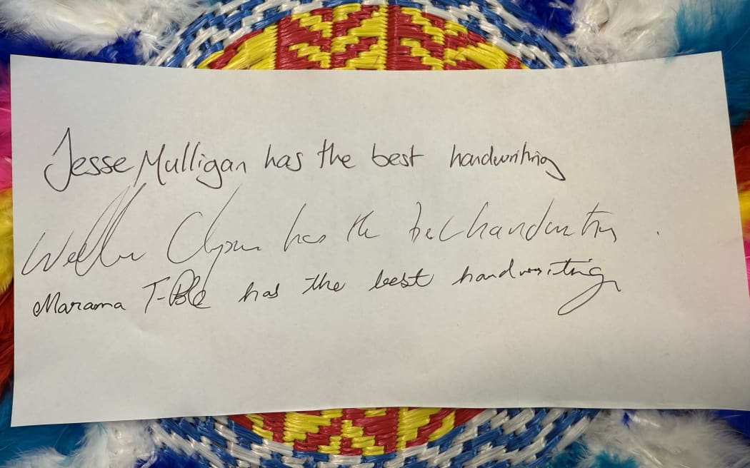 Jesse, Wallace and Marama show off their handwriting