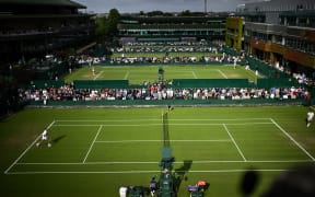 A photograph taken on July 2, 2024 shows a general view of courts (from front to back) 14, 15, 16, 17 on the second day of the 2024 Wimbledon Championships at The All England Lawn Tennis and Croquet Club in Wimbledon, southwest London. (Photo by Ben Stansall / AFP) / RESTRICTED TO EDITORIAL USE