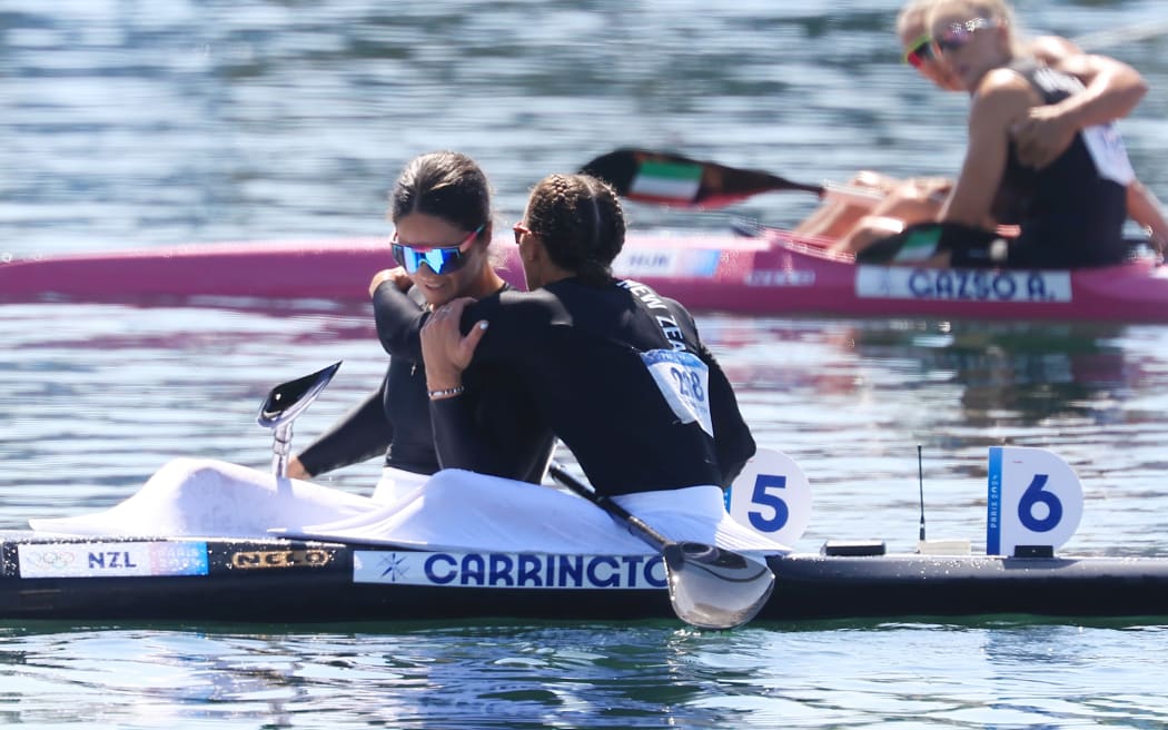 Lisa Carrington (hugging Aimee Fisher) of New Zealand wins gold in the women’s Kayak Single 500m gold medal final at Vaires-sur-Marne Nautical Stadium-flat water, Paris.