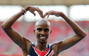 Mo Farah of Great Britain celebrates after a
10000m final win at a Moscow meet in 2013.