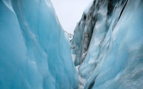 View while hiking through a carved out crevice on Fox Glacier, New Zealand