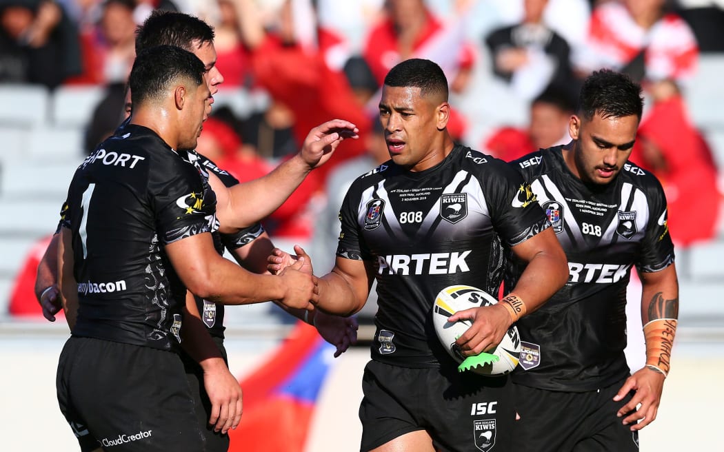 Jamayne Isaako is congratulated after scoring a try for the Kiwis.