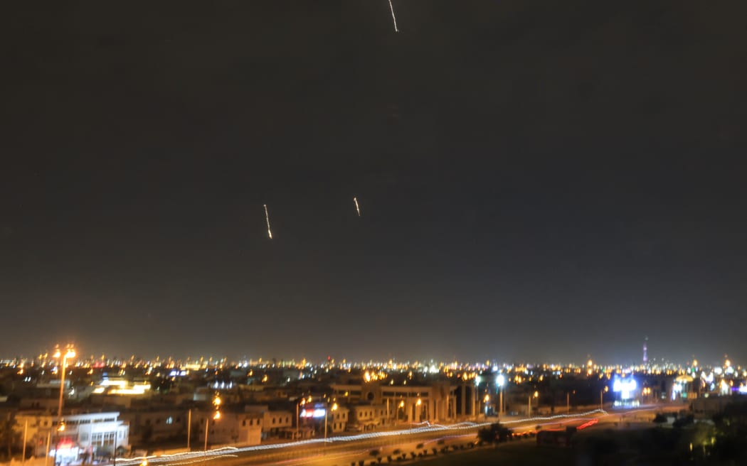 Missiles are seen in the skies over Doha on March 3, 2026. Qatar's military intercepted two ballistic missiles early in the morning of March 3, the country's defence ministry said in a statement, after AFP reporters heard loud explosions across Doha.
The conflict started by US and Israeli strikes on Iran over the weekend, which sparked retaliatory Iranian attacks across the region, showed no sign of abating as it entered its fourth day. (Photo by MAHMUD HAMS / AFP)