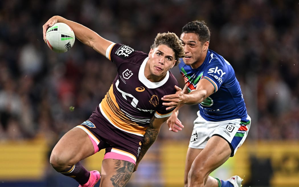 Broncos player Reece Walsh gets past Te Maire Martin of the Warriors  during the NRL preliminary final between the Brisbane Broncos and the New Zealand Warriors at Suncorp Stadium in Brisbane, Saturday, September 23, 2023. (AAP Image/Dave Hunt/www.photosport.nz)