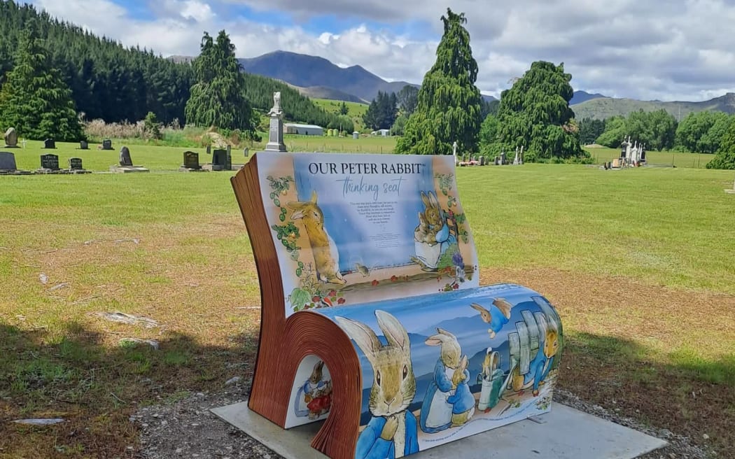 Newly installed Peter Rabbit thinking seat in Garston cemetery