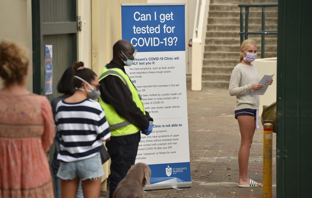 People line up at a Covid-19 coronavirus testing station at Bondi Beach in Sydney
