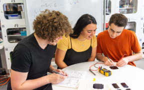 Astrix co-founders Max Daniels, Fia Jones and Willam Hunter (far right), testing space qualified space cells.