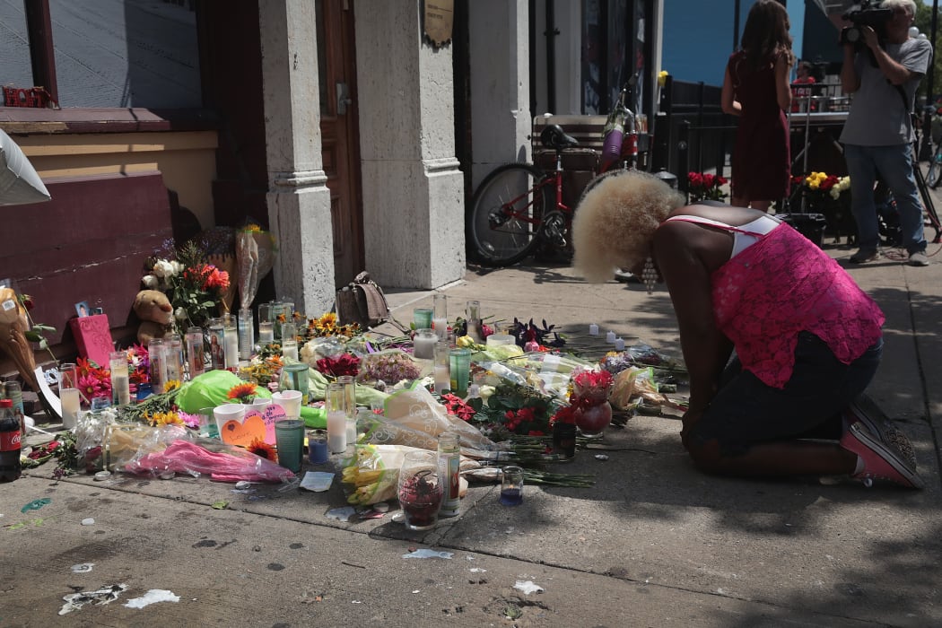 Annette Gibson-Strong visits a memorial to those killed in yesterday's mass shooting in Dayton, Ohio.