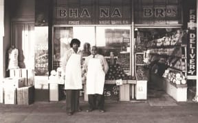 Bhana Fakir (right) poses for a photo with his son Narendra outside Bhana Brothers in Ponsonby.