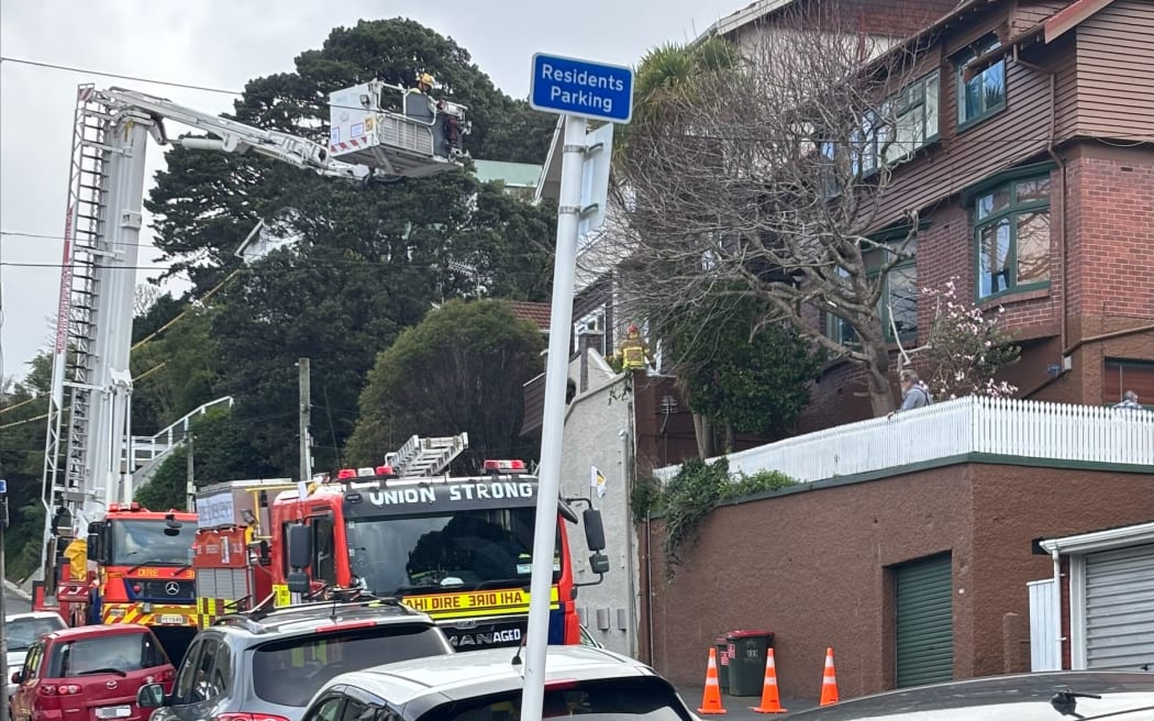 The Fire Service checking a building damaged by high winds on The Terrace in Wellington.