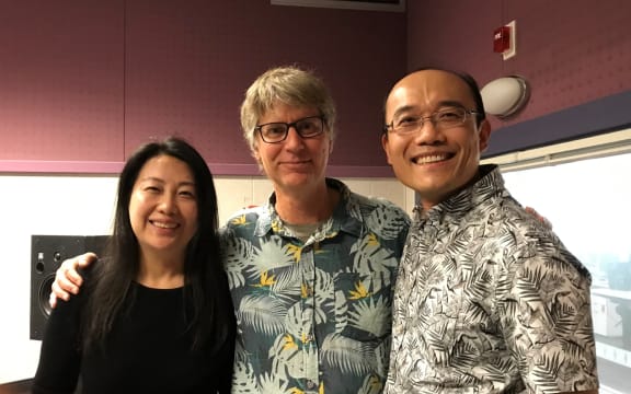 Co-founders of the New Zealand Music Trust, Freya Wang and Jian Liu, stand either side of Bryan Crump
