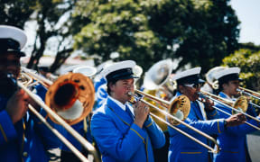 A band leads the procession of followers into Rātana temple as morehu celebrate the birthday of the faith's founder on 25 January, 2021.