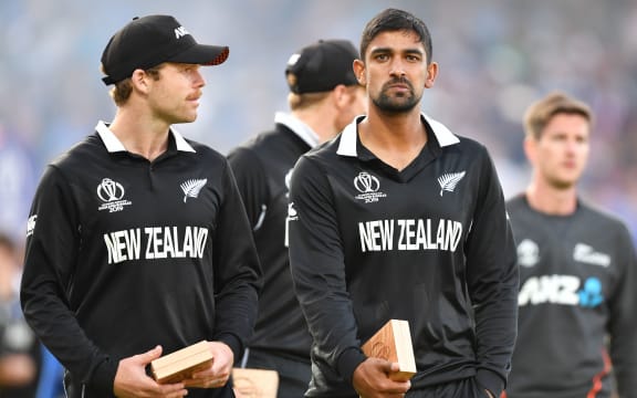 New Zealand's Lockie Ferguson (L) and New Zealand's Ish Sodhi (R) react to their defeat after the 2019 Cricket World Cup final between England and New Zealand at Lord's