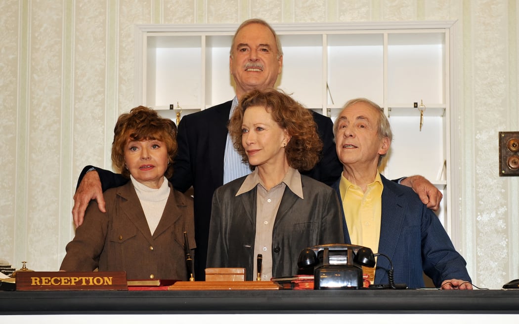(From L to R) Actors Prunella Scales, John Cleese, Connie Booth and Andrew Sachs pose for photographs as the original cast members of the British comedy programme "Fawlty Towers" attend a press conference in central London, on 6 May, 2009.