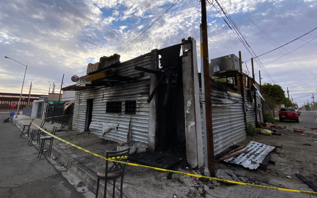 Picture released by La Tremenda Cosa showing a view of a bar that was intentionally burned and left eleven people dead in the town of San Luis Rio Colorado, Sonora state, Mexico on July 22, 2023. Eleven people died and another four were injured during the early hours of this Saturday in an intentional fire in a bar in northern Mexico, authorities reported. (Photo by Alberto De la Hoya / La Tremenda Cosa / AFP)