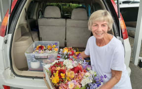 Linda Hart with some of the flowers she delivered to people around Tairua