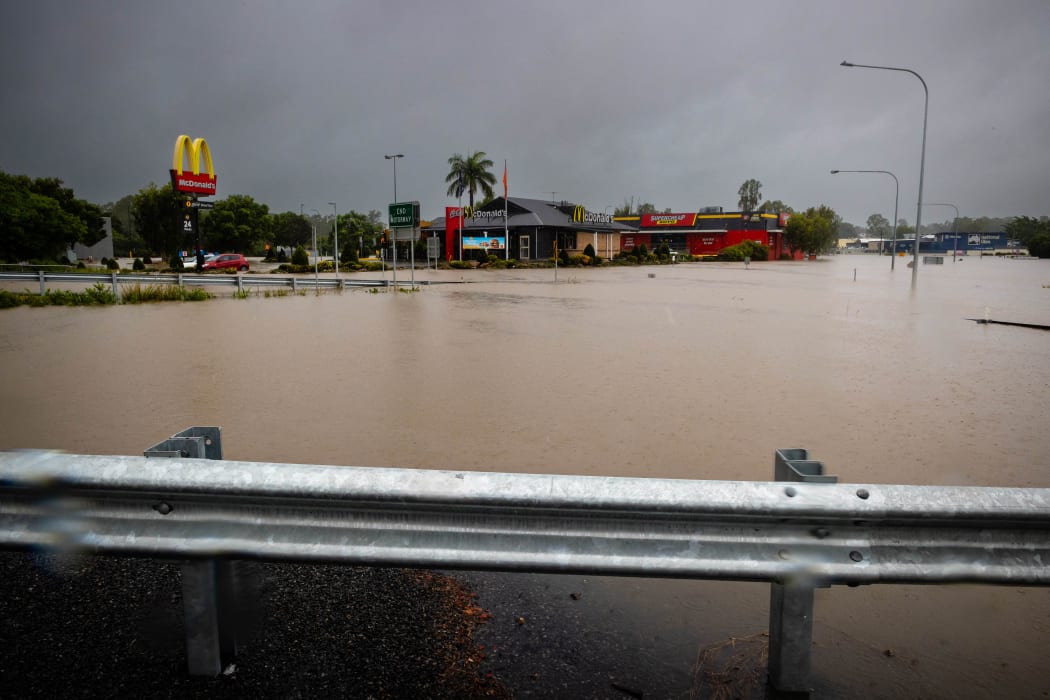 Floods from an overflowing Oxley Creek inundate roads at Rocklea, Australia's Queensland state on February 26, 2022.