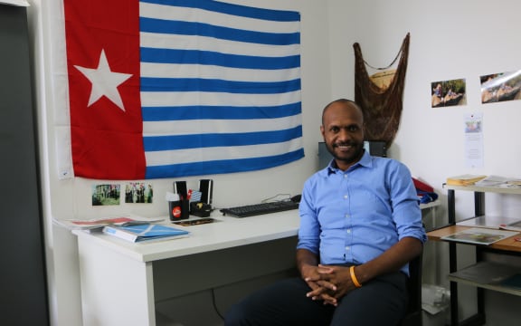 Wensislaus Fatubun sits at the West Papua Solidarity Desk, Auckland NZ.