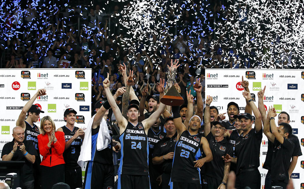 Breakers' CJ Bruton and Dillon Boucher lift the trophy with the team in 2012.