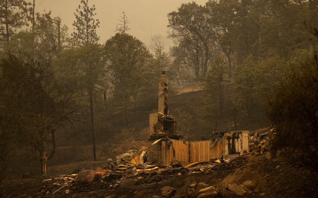 Property in the community of Klamath River lies in ruins after it burned in the McKinney Fire in the Klamath National Forest northwest of Yreka, California, on 31 July, 2022.