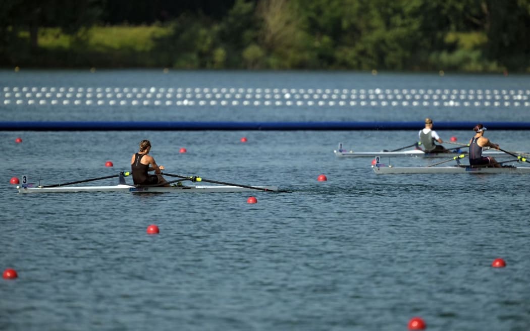 New Zealand's Emma Twigg (L) competes in the women's single sculls semifinal A/B rowing competition at Vaires-sur-Marne Nautical Centre in Vaires-sur-Marne during the Paris 2024 Olympic Games on August 1, 2024. (Photo by Bertrand GUAY / AFP)