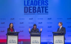 Jacinda Ardern and Bill English with one of the debate moderators Joanna Norris.