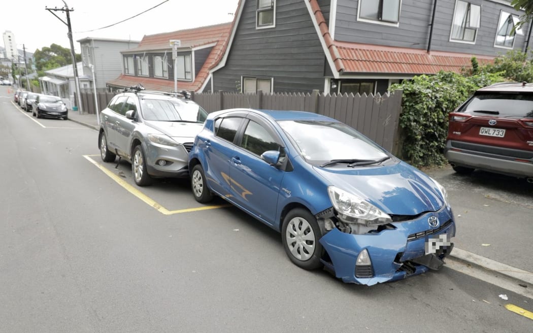 Multiple parked vehicles were damaged by a driver in a stolen vehicle towing a caravan that was fleeing police.