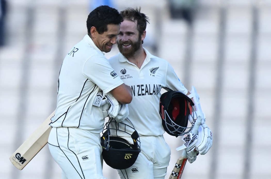 New Zealand's Ross Taylor (L) and New Zealand's captain Kane Williamson celebrate victory on the final day of the ICC World Test Championship Final between New Zealand and India at the Ageas Bowl in Southampton, southwest England on June 23, 2021.
