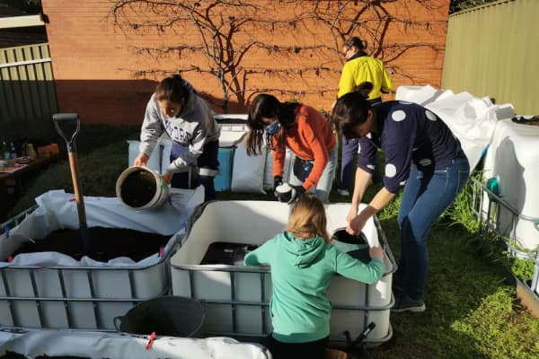Koren Helbig enjoys helping her friends make wicking beds in their backyard.