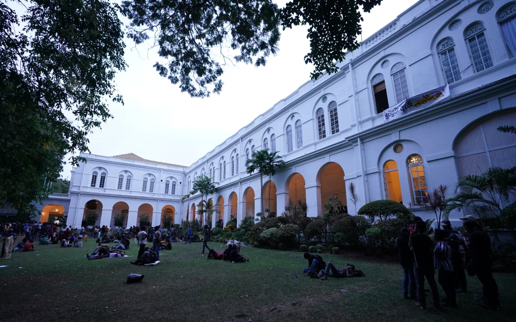 Protesters are seen in the grounds of the president's official residence after the anti government protest on 9 July, 2022, in Colombo, Sri Lanka.