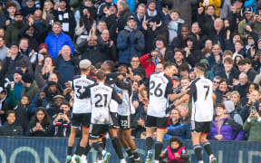 Fulham players celebrate a goal.