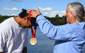 Paralympic bronze medalist presented with his medal at the Waka Ama Sprint Championships