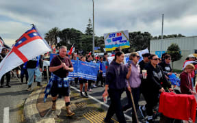 People marching through Patea in a hīkoi to oppose seabed mining, on 2 October, 2024.