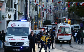 Ambulances arrive at the scene as police cordon off Istiklal Avenue following a huge blast on the busy Istanbul street.