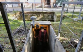 New Zealander Adrienne Smith coming out of the dugout at the Memorial Museum in Passchendaele, Belgium.