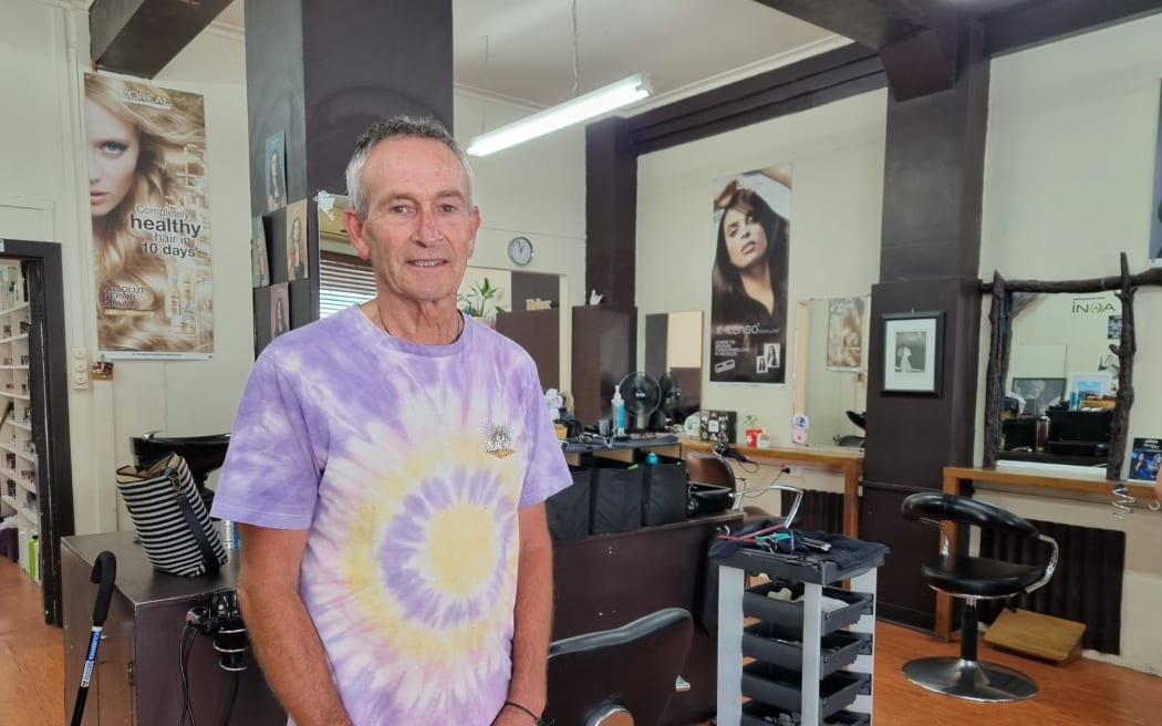 Kim Travers has stored buckets of water, which is then heated on a gas hob, to wash clients' hair at The Little Hair Shop.