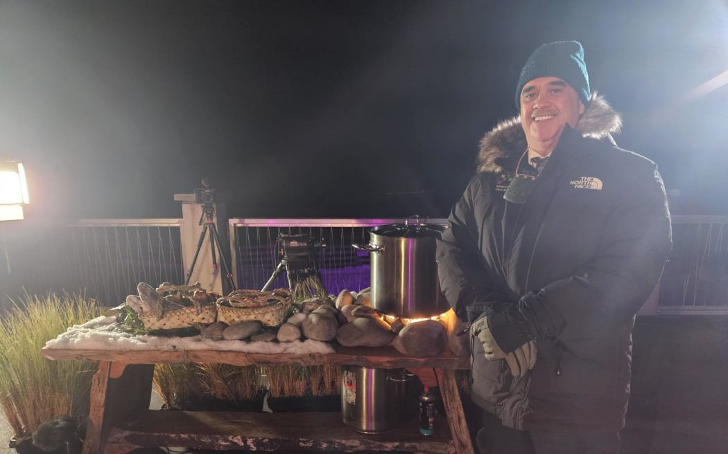 The umu is lit as final preparations for the hautapu ceremony are underway at Treble Cone. The weather over Wānaka is cloudy but Dr Rangi Mātāmua says if it doesn't clear he will superimpose the stars in post.