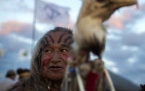 Phil Little Thunder Sr attends an evening gathering at an encampment where hundreds of people have gathered to join the Standing Rock Sioux Tribe's protest against the construction of the Dakota Access Pipeline.