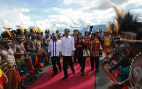 President Joko Widodo is welcomed to Jayapura, the capital of Papua