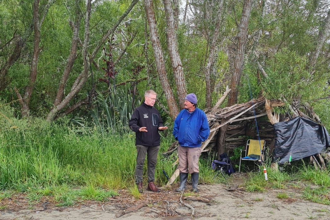 Richie Cosgrove chats with an angler near the Waimakariri River mouth.