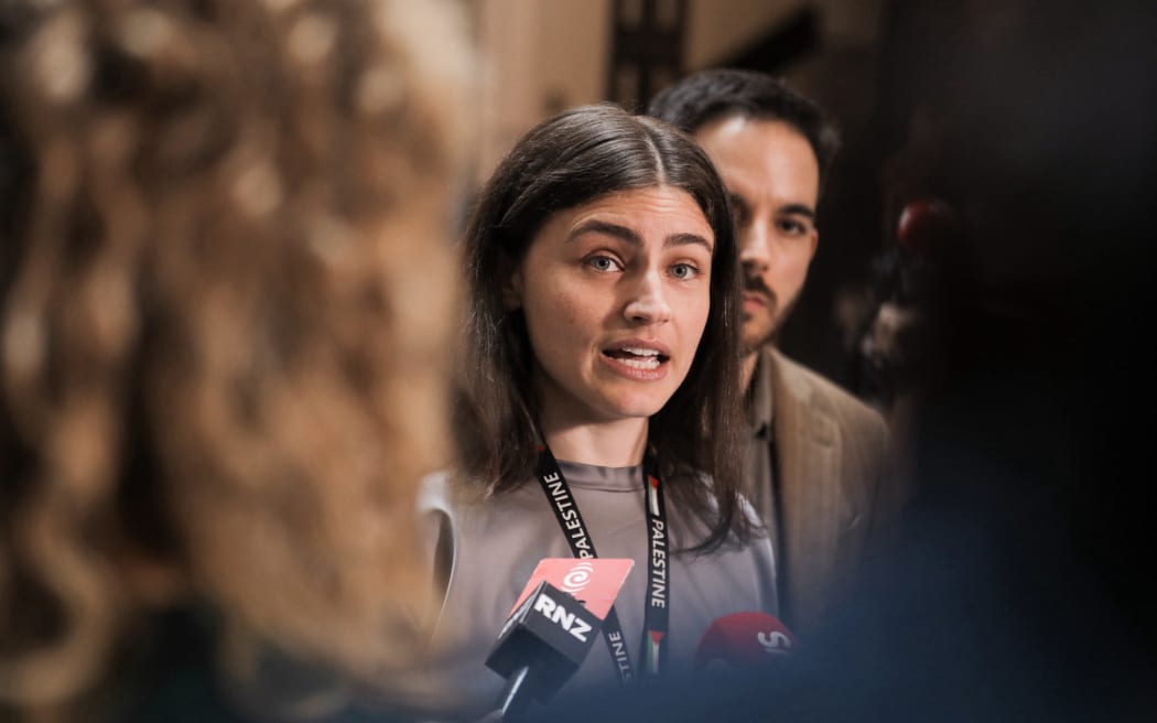 Chloe Swarbrick speaks at a media stand up on the tiles at Parliament after Darleen Tana was ejected from Parliament.