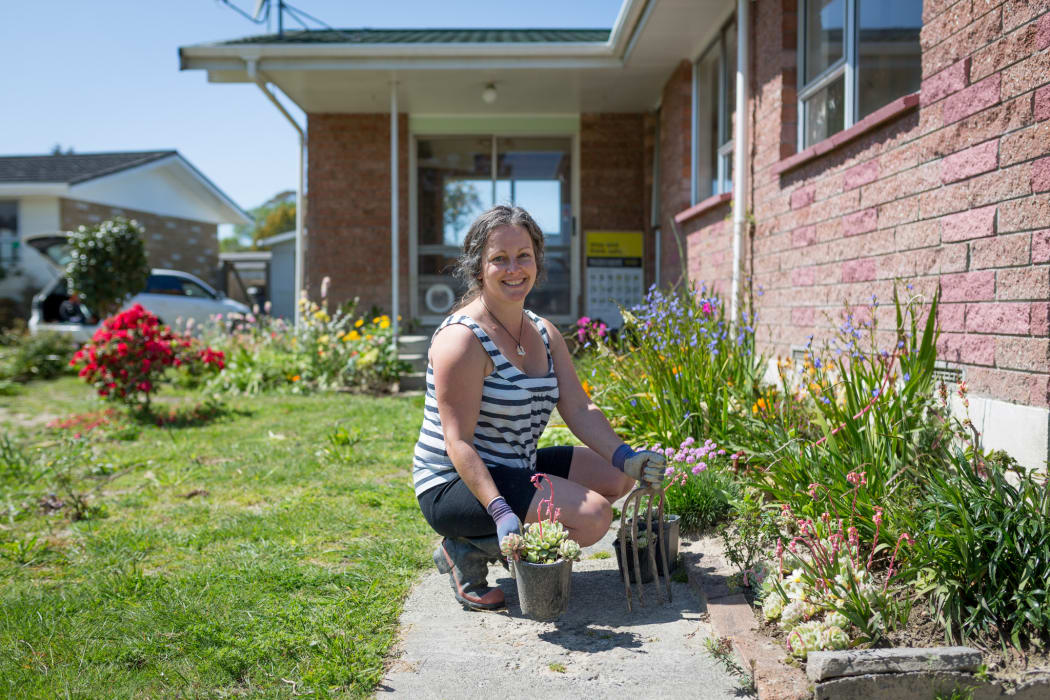 Kristy Lowe is still wearing other people's clothes, using other people's furniture and living in someone else's house while she waits for her own home to be repaired.