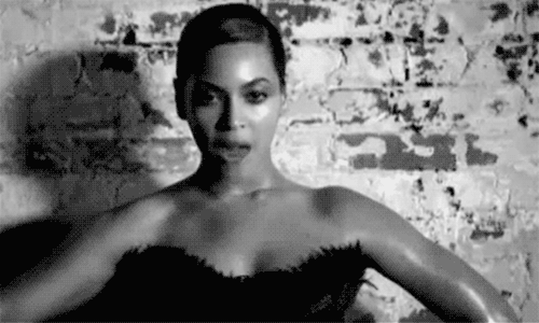 A gif of Beyonce with a fan of cash
