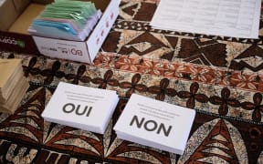 This photograph taken on December 12, 2021 shows ballots reading "Yes" and "No" for the referendum on independence at a polling station of the City Hall in Noumea, on the French South Pacific territory of New Caledonia
