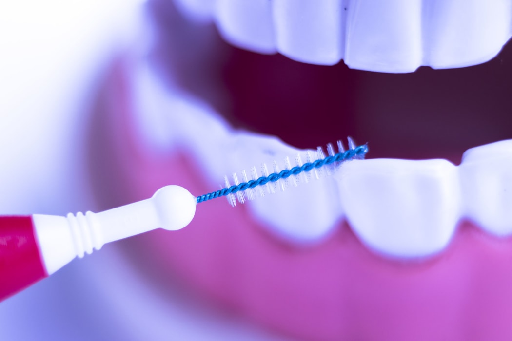 Inter dental teeth cleaning brush healthy floss action between each tooth to remove plaque.