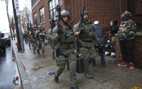 Police officers arriving at the scene of the shooting in Jersey City, New Jersey.