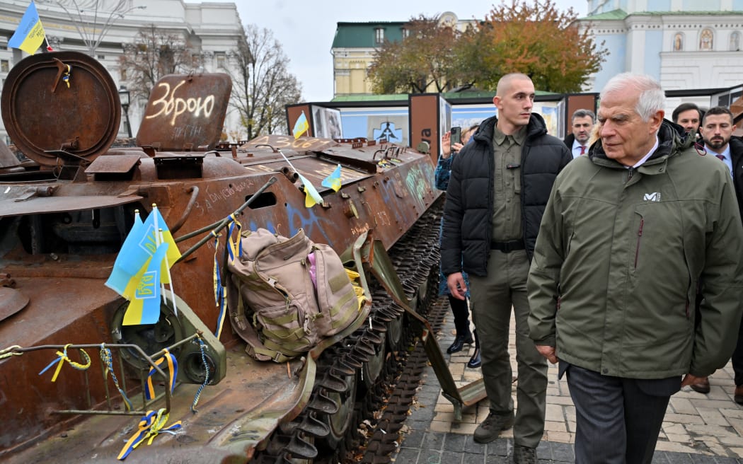 High Representative of the European Union for Foreign Affairs and Security Policy Josep Borrell (R) eaxmines destroyed Russian military equipment at an open air exhibition in Kyiv on November 9, 2024, amid the Russian invasion of Ukraine. (Photo by Sergei SUPINSKY / AFP)