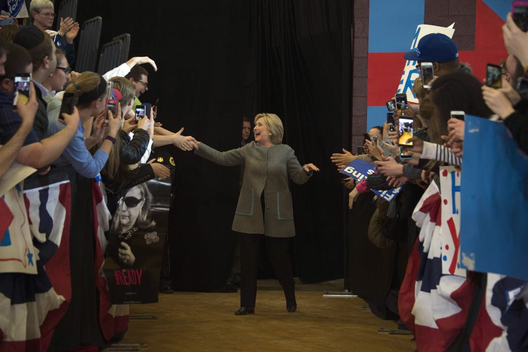 Democratic presidential candidate Hillary Clinton greets supporters at Abraham Lincoln High School in Des Moines, Iowa on Sunday 31 January.